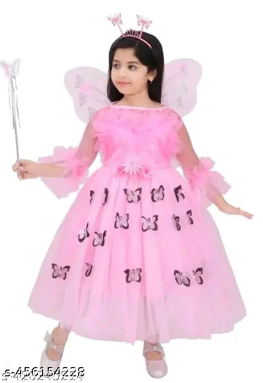Pink tulle dress with fairy wings and wand