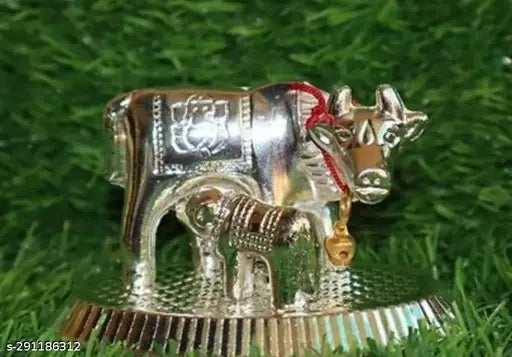 Metal handmade silver Kamdhenu cow with calf spiritual showpiece, ornate Indian figurine for home decor and car dashboards