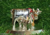 Metal handmade silver Kamdhenu cow with calf spiritual showpiece, ornate Indian figurine for home decor and car dashboards