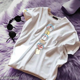 White cotton t-shirt with graphic back print featuring three characters, black sunglasses in upper left corner