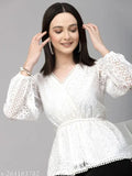 White cotton peplum top with long sleeves, V-neck, wrap style, lace fabric, self design, India