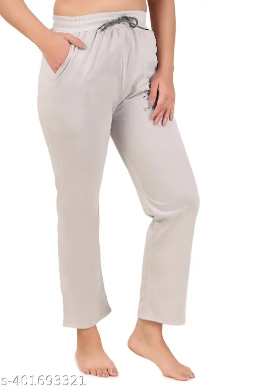 Light beige track pants with a lower track and lower leg printing for girls