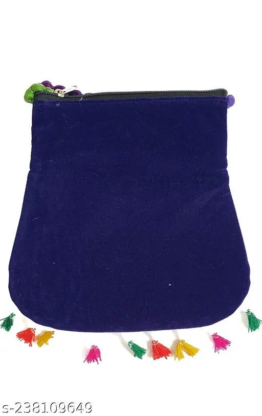 Stylish Rajasthani blue sling bag with colorful pom poms trim