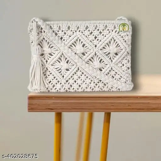 White crocheted fabric handbag with beige tassel, crossbody strap