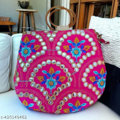 Mirror embossed bangle clutch, vibrant pink fabric with intricate paisley embroidery