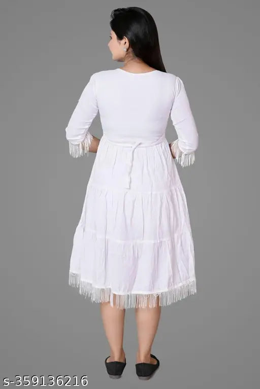 White cotton knee-length skirt with fringe detail