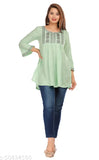 Green rayon casual top with three-quarter sleeves, embroidered net pattern, perfect for women's relaxed style. Beautifully feminine and elegant, this 3/4 sleeve regular top from India