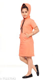 A girl wearing a bright orange hooded cotton dress with red checks