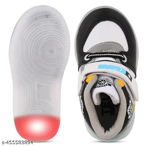 A pair of white, black, and red kids' walking shoes with visible LED lights in the soles