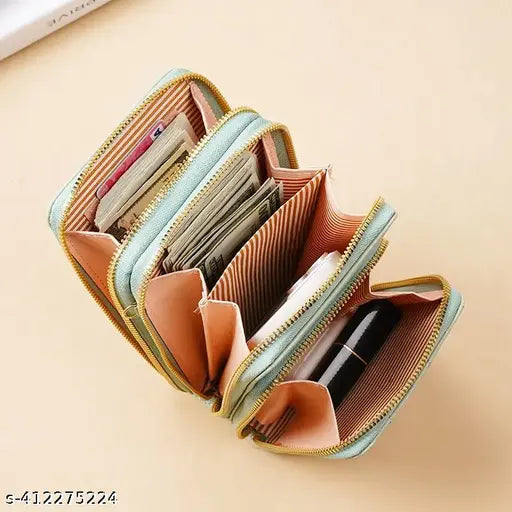 A slim pink wallet with multiple slots, a zip closure, designed for girls and women