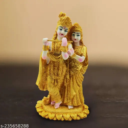 Gold-plated poly resin Radha Krishna statue for home decor, ideal for living room showpieces or pooja mandir interior decoration accessories. Dimensions: 19 x 11 x 11 cm