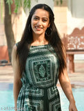 Green rayon printed A-line sleeveless casual mini jumpsuit for girls on mannequin