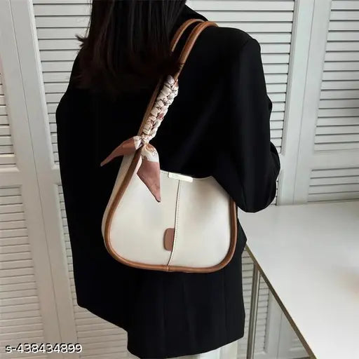 Black leather purse with pink ribbon, adjustable strap