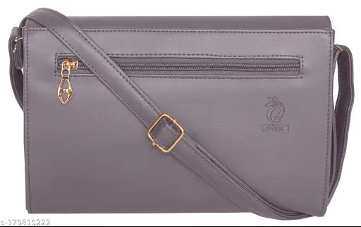 Purple leather cross body sling bag with multiple pockets and zipper closure