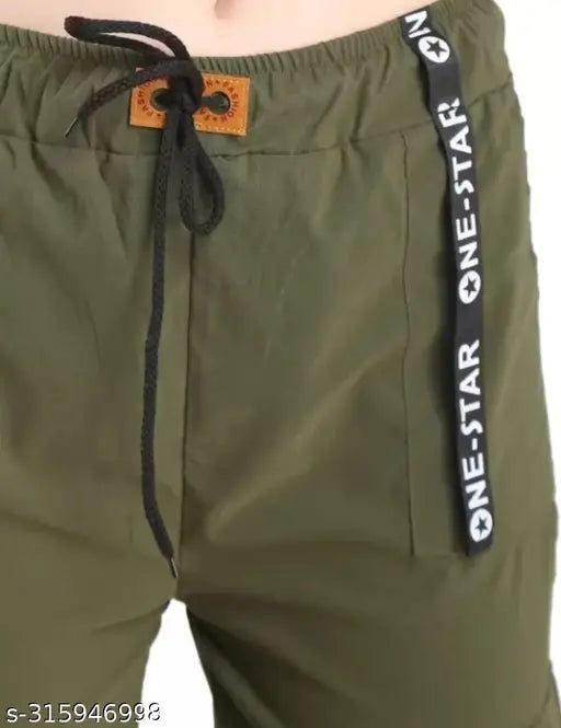 A dark green pant with a small black drawstring at the waistband and a white print on the right leg, showcasing its design