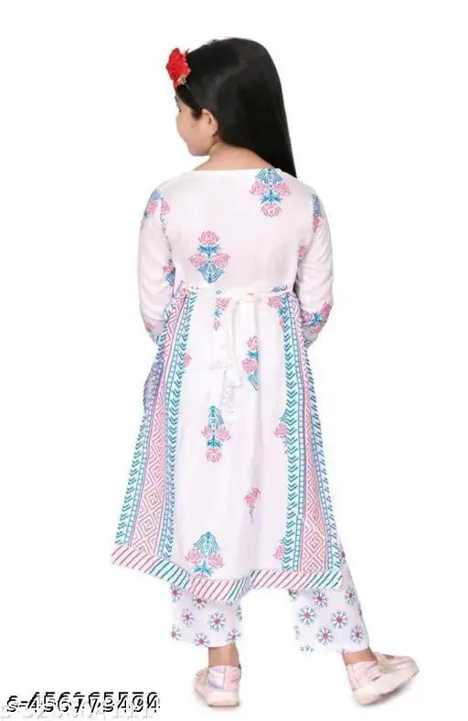 Green printed rayon kurti & palazzos set with lace border, ideal for girls' festive occasions