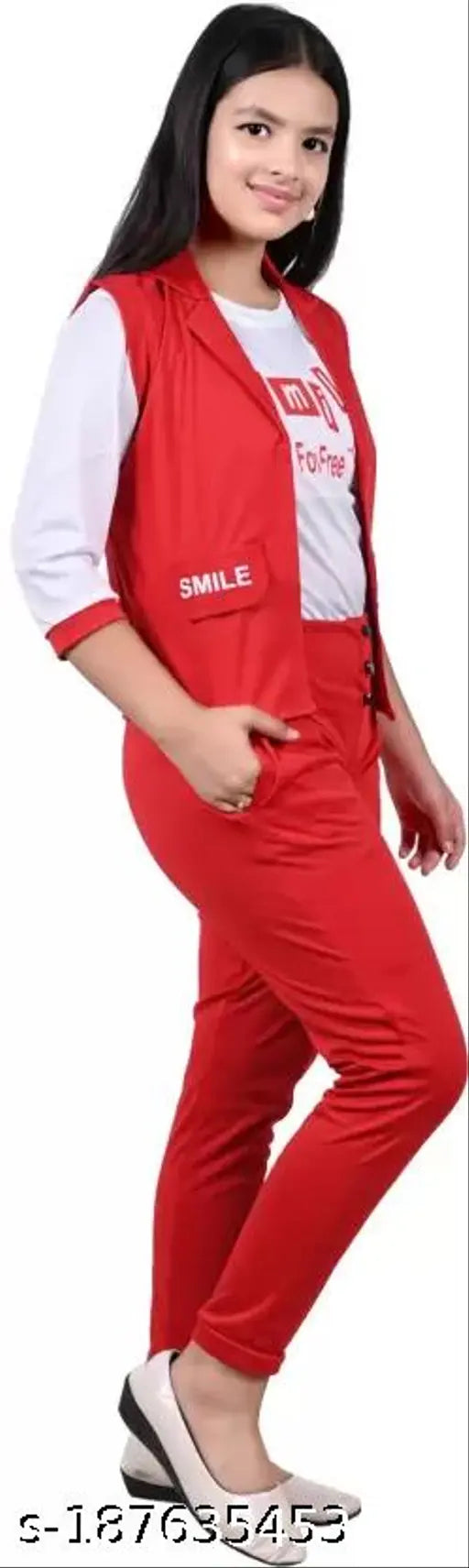 A girl wearing a red three-piece dress set, consisting of a printed white t-shirt with cut sleeves, a red jacket, and red pants, all made of cotton blend material. The outfit is displayed against a white background