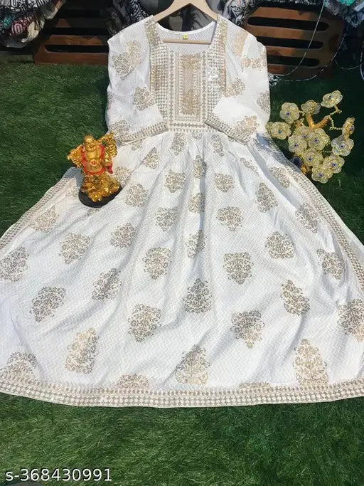 Gold rayon kurti with printed Naira design, three-quarter sleeves, available in M (38in), L (40in), XL (42in), XXL (44in), XXXL (46in), 4XL (48in), 5XL (50in), 6XL (52in). Indian handcrafted ethnic women's fashion