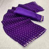 Purple and gold paisley patterned bandhani saree
