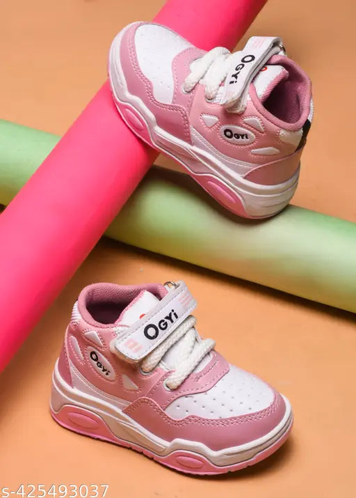 Pink boys' or girls' sports shoes, with velcro straps