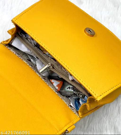 Yellow sling purse with multiple card slots and a key ring