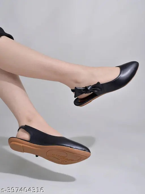 Black synthetic ballerinas with side bow detail, comfortable flat belly design for women and girls by Shoetopia. Slip-on style, solid pattern. Indian origin