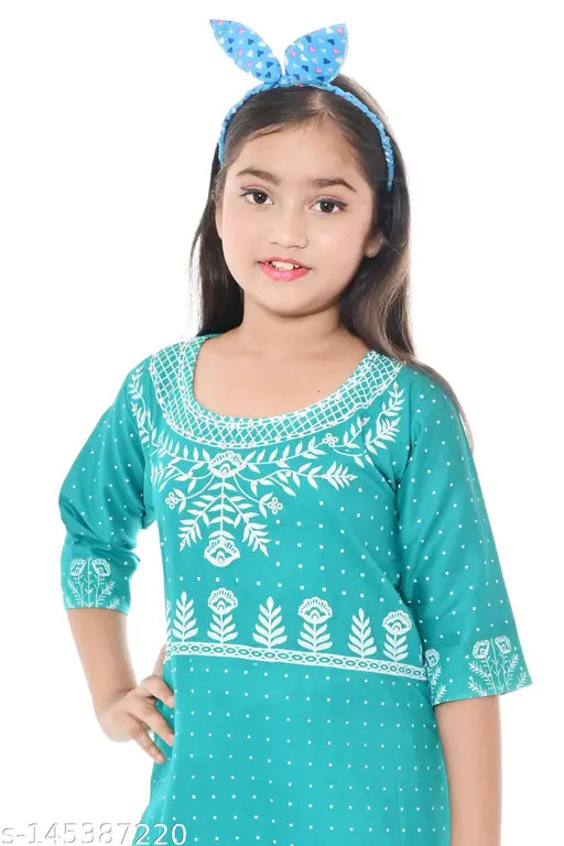 Printed rayon A-line kurti sharara set for girls, featuring three-quarter sleeves and knee-length top. Perfect for festivals and versatile mixing with other wardrobe items. India origin