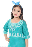 Printed rayon A-line kurti sharara set for girls, featuring three-quarter sleeves and knee-length top. Perfect for festivals and versatile mixing with other wardrobe items. India origin