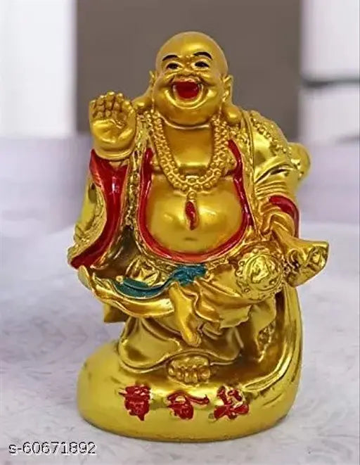 Golden laughing Buddha figurine with red jewelry and a smiling face