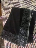 Black and white sari on a table