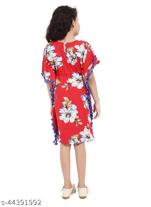 Printed rayon kaftan dress for girls aged 4-7, featuring short sleeves, net pattern, and adjustable tassels, ideal for summer outings or home wear (4-5 Years: Bust 26 in, Length 26 in / 5-6 Years: Bust 28 in, Length 26 in / 6-7 Years: Bust 30 in, Length 28 in), made in India