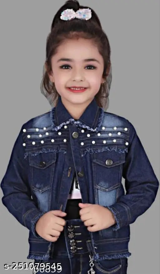 Small child posing in a denim jacket with a big smile, white bow on hair