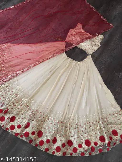 Cream-colored art silk embellished sequinned semi-stitched lehenga, unstitched blouse with net dupatta. Indian traditional wear set for bridal or festive occasions