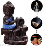 Blue and black meditating monk Buddha statue with smoky waterfall incense holder, 10cm L x 10cm W x 10cm H. Decorative showpiece with free scented cone incenses. Perfect housewarming gift for any home. Made in India