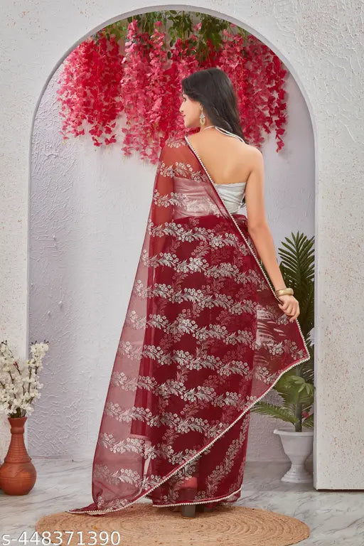 Embellished daily wear net saree in brocade, featuring solid blouse with embroidered pattern and lace border. Trending chiffon saree for Diwali, Durga Puja, Raksha Bandhan, Navratri, or Karwa Chauth events, available in a variety of colors like black, red, gold, yellow, or georgette. Free size (Saree length 5.5m, Blouse length 0.8m), originating from India
