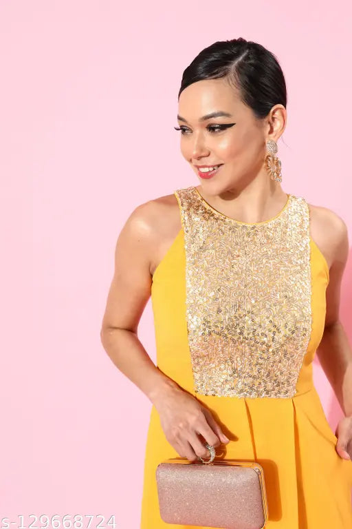 Mustard solid halter neck polyester jumpsuit by Miss Chase, sleeveless design with pleats, XS-XL sizes available