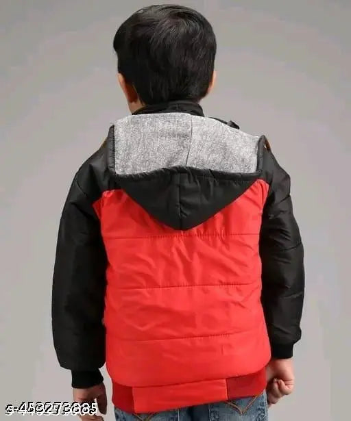 A young boy in a red and black jacket, with a hood