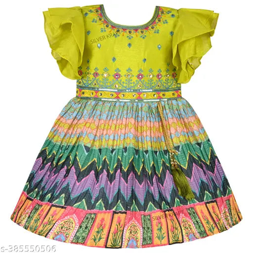 Parrot green embroidered silk-blend knee length dress, featuring round neck, double umbrella sleeves, vibrant multicolor print, pleated fabric, back zip opening, and attached tassels. Frocks for girls, party wear for kids. Indian origin