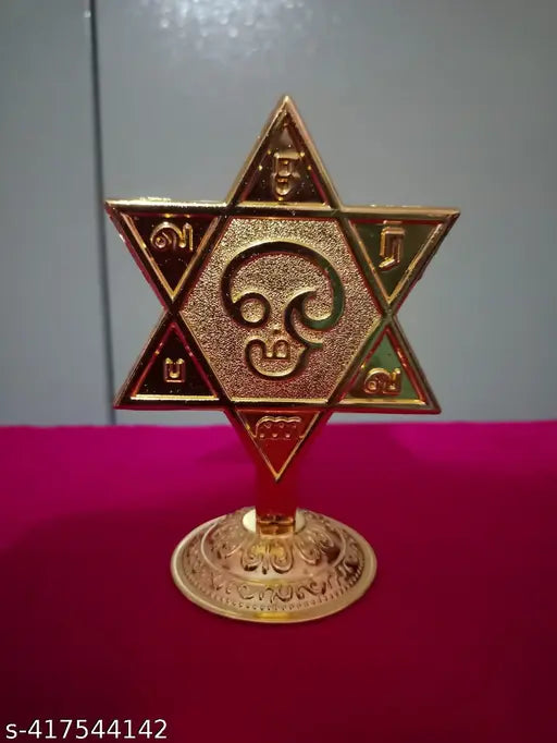 Golden Metal Murugan SARAVANA Star-shaped Vel - Elegant 3.5-inch representation of Lord Murugan's sacred symbol for protection and victory, perfect for pooja rooms, offices, or gifting. Crafted from durable metal with a radiant golden finish