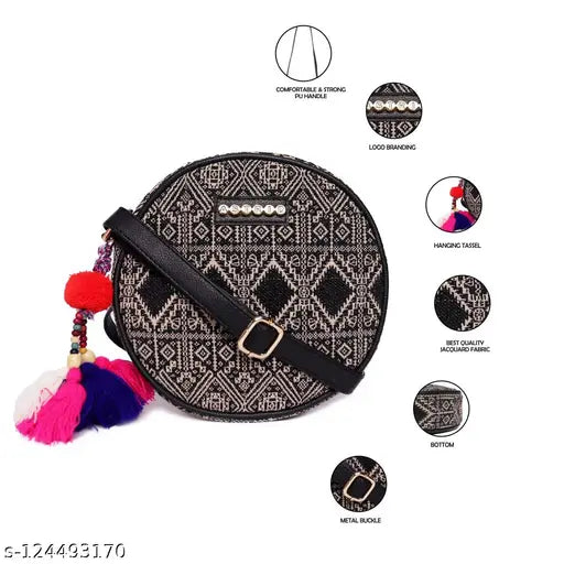 Black, white, and pink round sling bag with pompoms