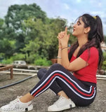 Black leggings with red and white striped top