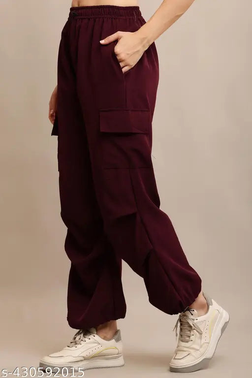 A woman wearing purple sweatpants