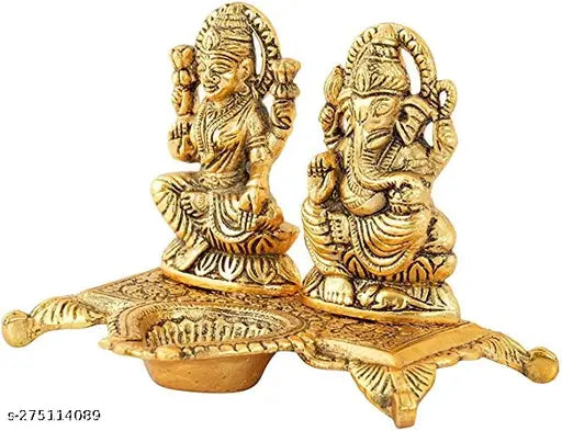 Golden brass idols of Laxmi and Ganesha with a diya, decorative home office gift for Diwali celebration