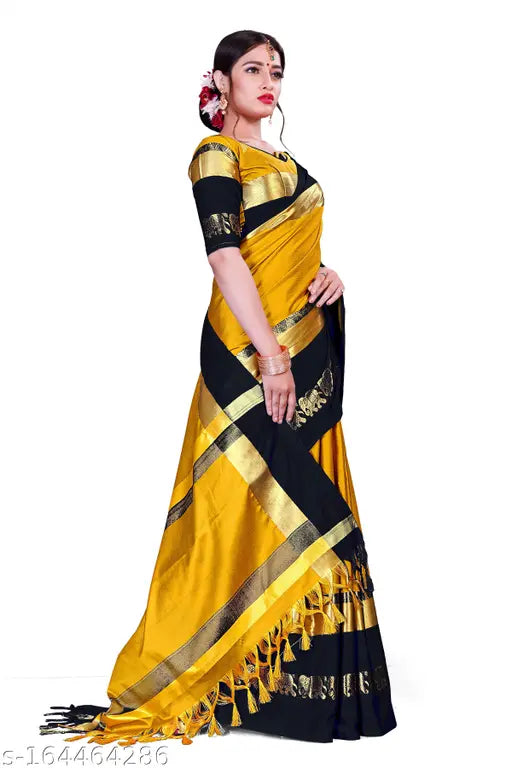 Aishwarya Rai Bachchan in a vibrant yellow saree with gold border, wearing traditional Indian attire