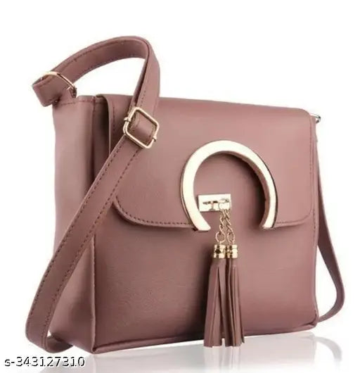 Purple patent leather handbag with gold faux chain accents, keyhole embellishment