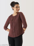 Brown cotton-blend solid top with three-quarter sleeves, perfect for modern Indian women's ethnic wear. Prettify casual crew neck style, comfortable silhouette. Made in India