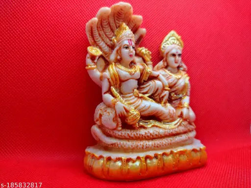 Yellow and red resin figurine of two deities
