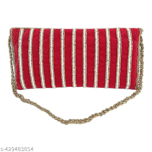 Maroon velvet clutch with gold trim, zip closure
