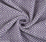 The image displays a fabric with a zigzag pattern, resembling a chevron design. It is in a light blue color and seems to be of a high quality material