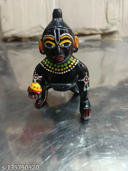 Brass figurine of Lord Gopal with black attire and dressjwellery, number 4, size 4